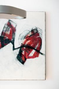 a painting of two umbrellas on a wall at Aparthotel Saladina in Gaschurn