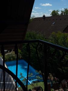 a view of a swimming pool from a balcony at Villa Balifornia in Balatonboglár