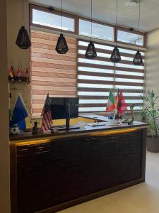 an office with a desk with a computer on it at Center Side in Prizren