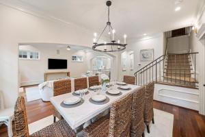 a dining room and living room with a table and chairs at 5556 Cypress Point in Kiawah Island