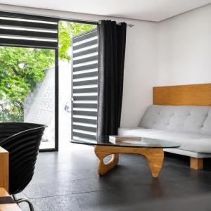 a living room with a couch and a coffee table at Casa Caballero y Osio in Querétaro