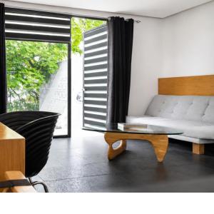 a living room with a couch and a coffee table at Casa Caballero y Osio in Querétaro