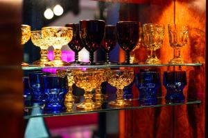 a group of wine glasses on display in a store at The Truitt in Saint Louis