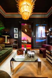 a living room with a couch and a table at The Truitt in Saint Louis