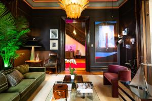 a living room with a couch and a table at The Truitt in Saint Louis +33 photos