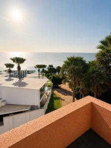 a view of the ocean from the balcony of a building at Teranga Tides in Bijilo