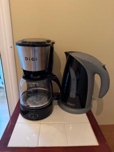 a black blender sitting on top of a counter at Little Paradise Livadi Himare in Himare
