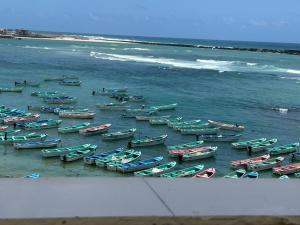 a bunch of boats lined up on the beach at Aluruba Residence in Mogadishu