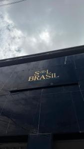 a sign on the side of a building at Hotel Sol Brasil in Fortaleza