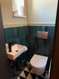a bathroom with a white toilet and a sink at Luxury Stay Vienna in Vienna +16 photos