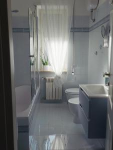 a bathroom with a tub and a toilet and a sink at Domus Flumen in Alife +16 photos