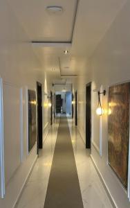 a hallway in a building with a long corridor at Eraton Hotel in Warri