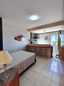 a hotel room with a bed and a kitchen at Golden Dolphin Grand Hotel piscinas 24 hs MP in Caldas Novas +111 photos