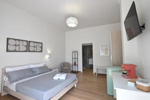 a bedroom with a bed and a living room at Villa Grazia in Oliveto Citra