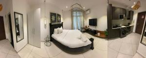 a bedroom with a white bed and a kitchen at Embassy Gardens Studio Accra in Accra +46 photos