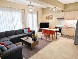a living room with a couch and a table at Elena's nest in Kastoria