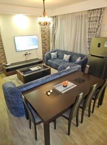 a living room with a couch and a table at SS Kileleshwa Homes in Nairobi