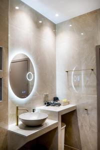 a bathroom with a sink and a mirror at Zen Garden Villa in Theológos +59 photos
