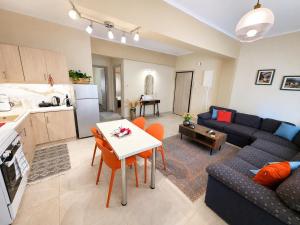 a living room with a couch and a table at Elena's nest in Kastoria