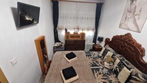 a bedroom with a large bed and a window at Lovely Holiday in Alicante