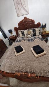a bedroom with a large bed with two pillows on it at Lovely Holiday in Alicante