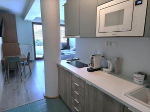 a kitchen with a sink and a counter top at Apartmány Kvetná in Rajecké Teplice