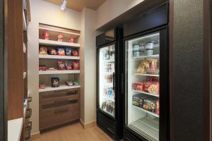 a kitchen with an open refrigerator filled with food at Residence Inn by Marriott Helena in Helena