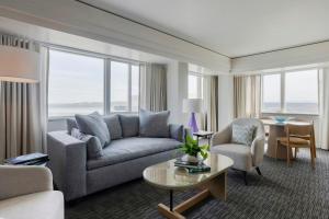 a living room with a couch and a table at Hotel Murano in Tacoma