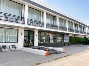 a building with an orange cone in front of it at Srianunt Boutique Hotel in Buriram