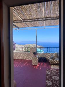 a view from a room with a view of the ocean at Belyounech in Belyounech 