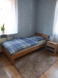 a bedroom with a bed in a room with a window at Ferienwohnung in Flörsheim am Main