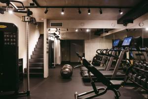 a gym with tread machines and a treadmill at Palazzo Caterina in Hvar