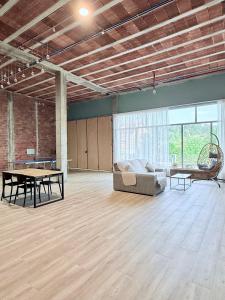 a large room with a couch and a table at Casa Romai Portas in Romay