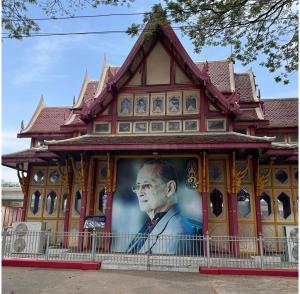a building with a picture of a man on it at SOLEIL HAUS - Huahin in Hua Hin