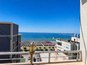a view of a parking lot from a balcony at Hotel Mjeshtri in Shëngjin