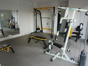a gym with several treadmills and machines in it at DFC Salta Estudio 2p in Salta