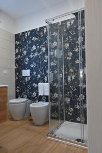 a bathroom with a shower and a toilet at Villa Grazia in Oliveto Citra +32 photos