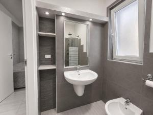 a bathroom with a sink and a mirror at Apartment Federico in Melfi