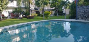 a swimming pool in front of a building at Villa Salvatore in Chiconcuac