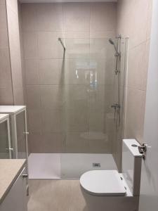 a bathroom with a shower with a toilet and a sink at APARTAMENTO LEPANTO in Almazora
