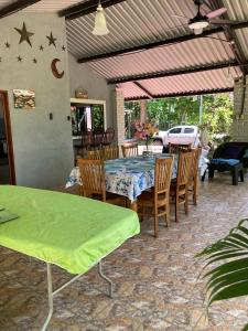 a patio with a table and some chairs and a table and chairsktop at Beach House EL Cocalito in La Libertad
