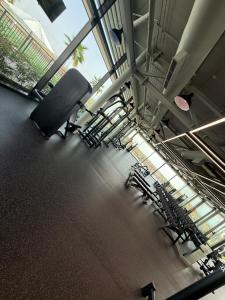 an empty room with chairs and tables in a building at Yas island Golf collections in Abu Dhabi