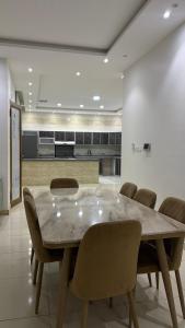 a large dining room with a table and chairs at فلة وشاليه ابحر الشمالية in Jeddah