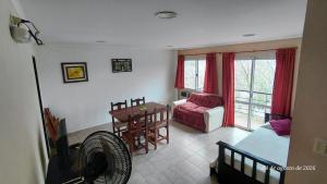 a living room with a couch and a table at Ayalata del Rio in Colón