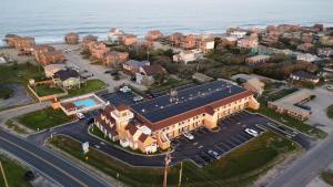 an aerial view of a small town next to the ocean at Hatteras Island Inn in Buxton