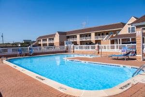 a large swimming pool in front of a building at Hatteras Island Inn in Buxton