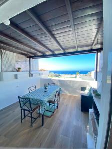 a dining room with a table and a view of the ocean at Sea View Colony Club in Puerto del Carmen