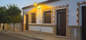 a building with a door on a street at Los Llanos Loft & Suites in Manzanilla