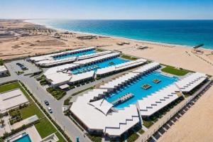 an aerial view of a resort and the beach at Azur White Resort Ras El Hekma in Zāwiyat al ‘Awwāmah