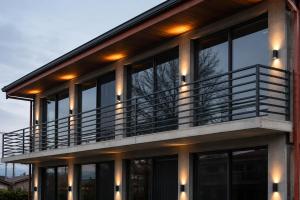 a house with a balcony with lights on it at Garslyan Boutique Hotel in Ninotsminda